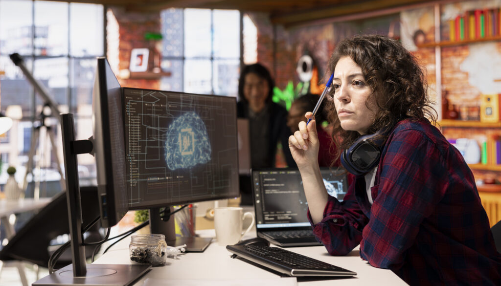 Woman working in AI tech agency providing custom software development services