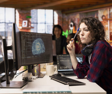 Woman working in AI tech agency providing custom software development services